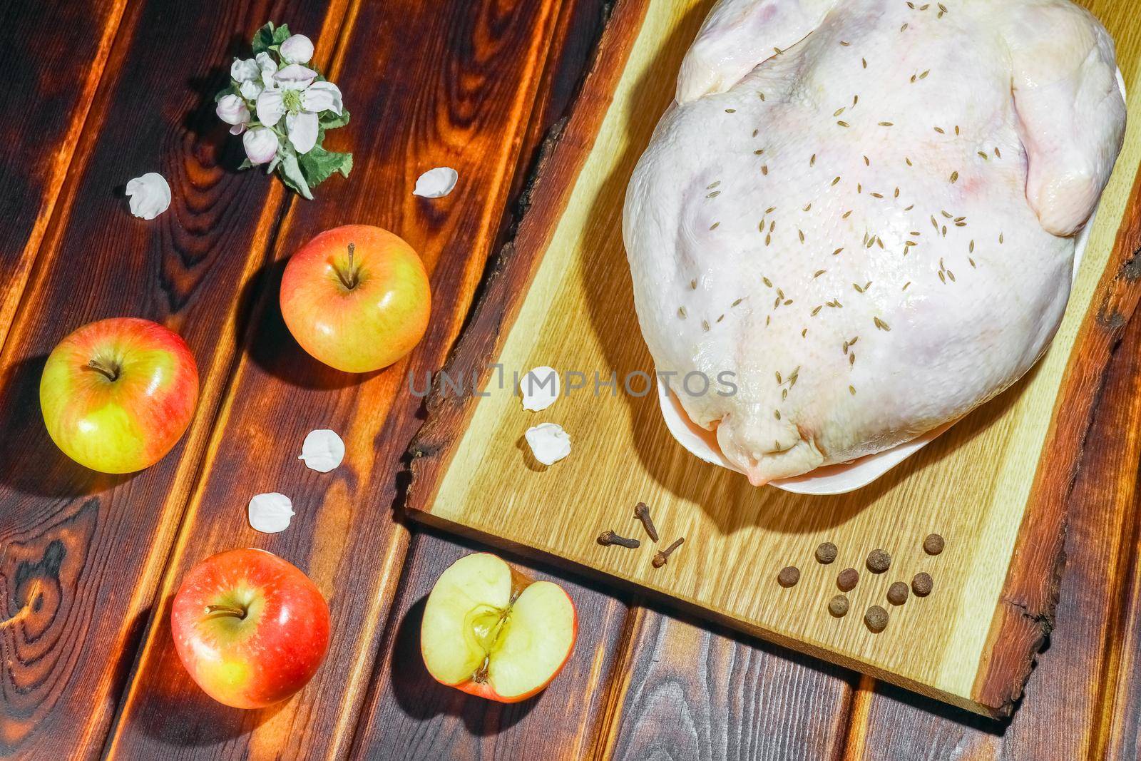 chicken with apples on a chopping Board. High quality photo