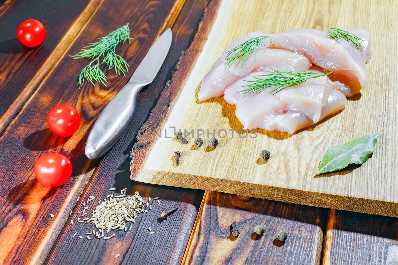 chicken fillet on a cutting Board top view by roman112007