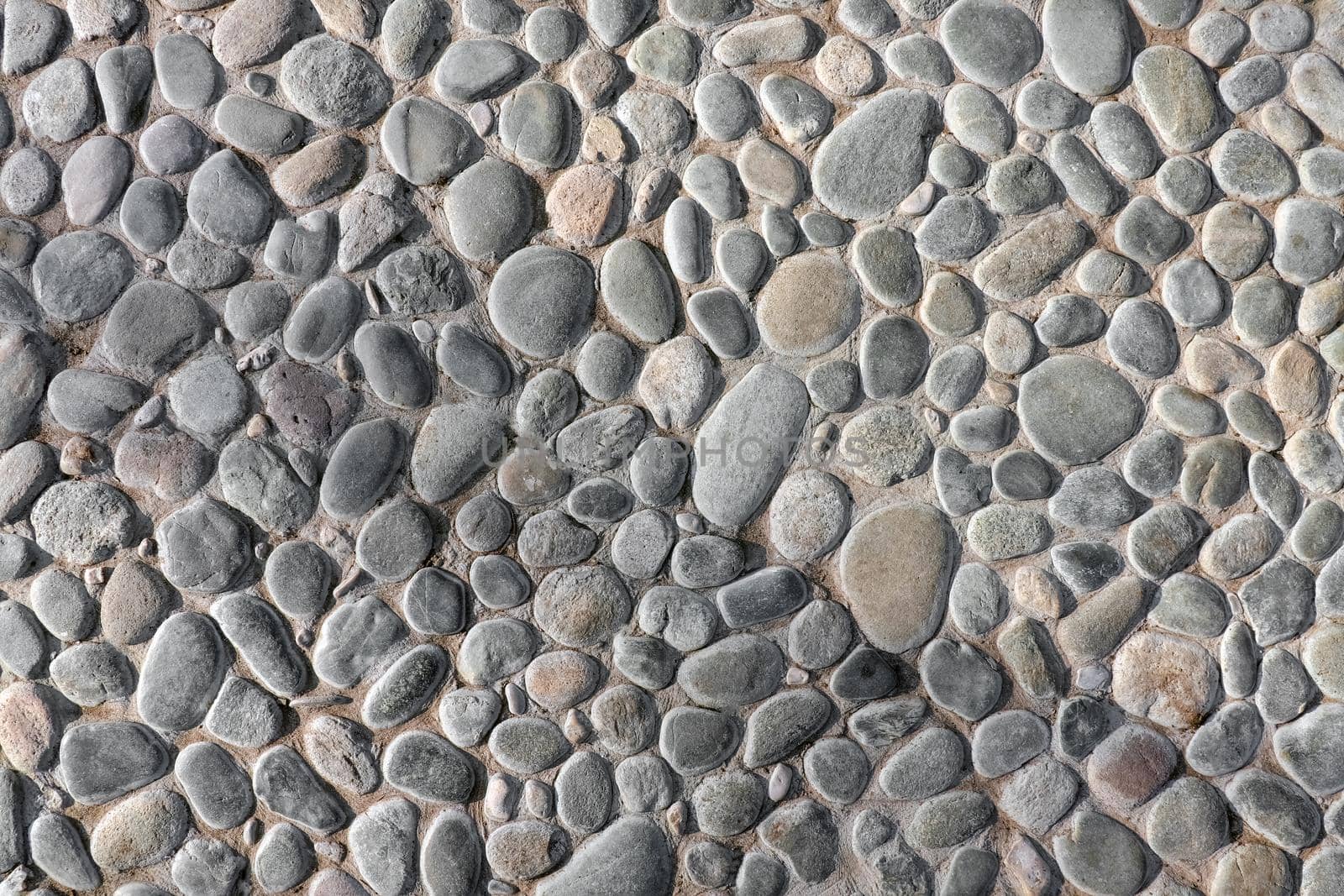 masonry wall paving stones as a background close up by roman112007