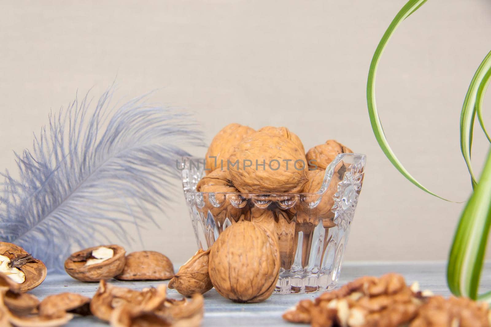 Walnuts in a shell in a crystal vase. Healthy nuts. Walnuts.  