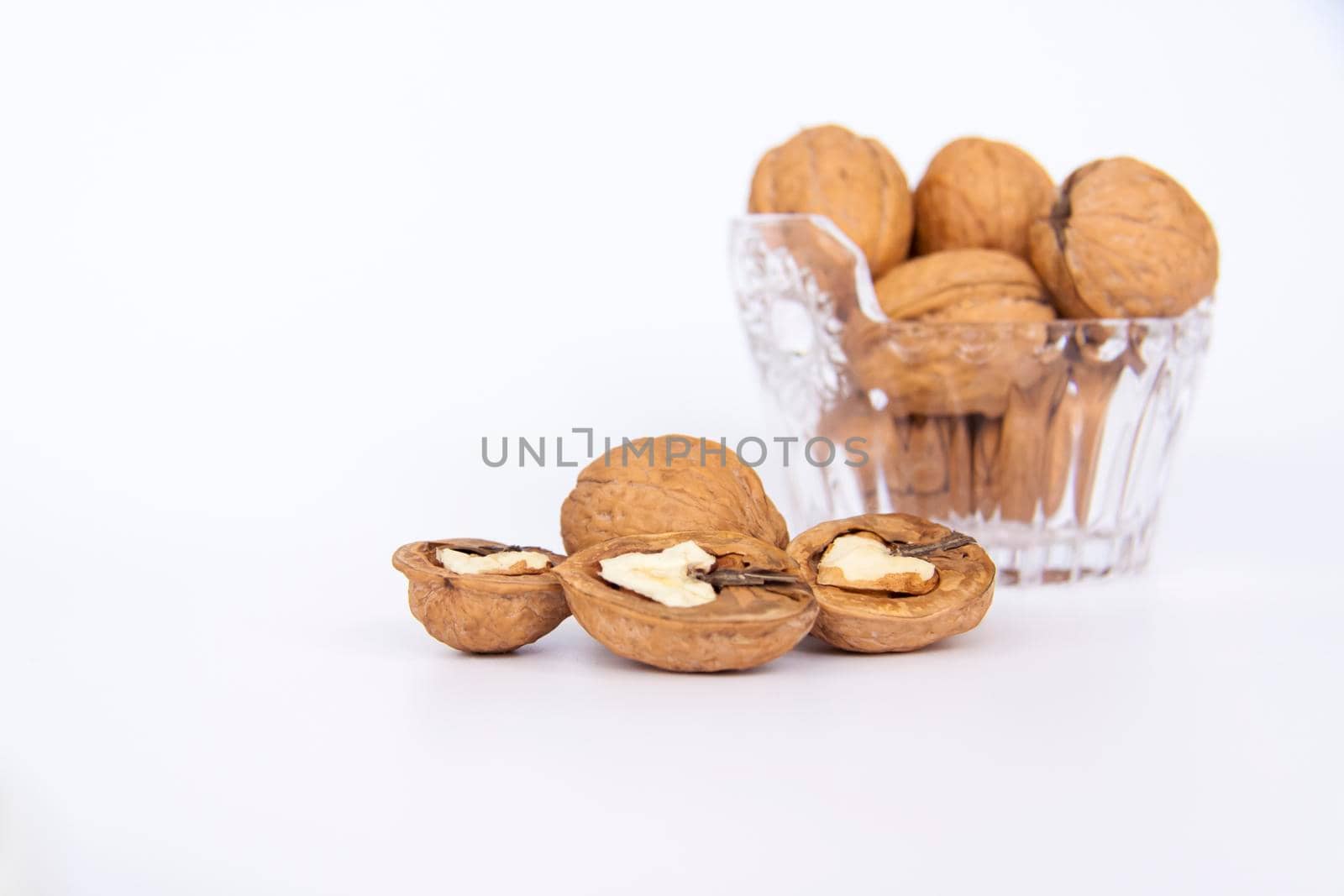 Walnuts in a shell on a white background. Healthy nuts. Walnuts.