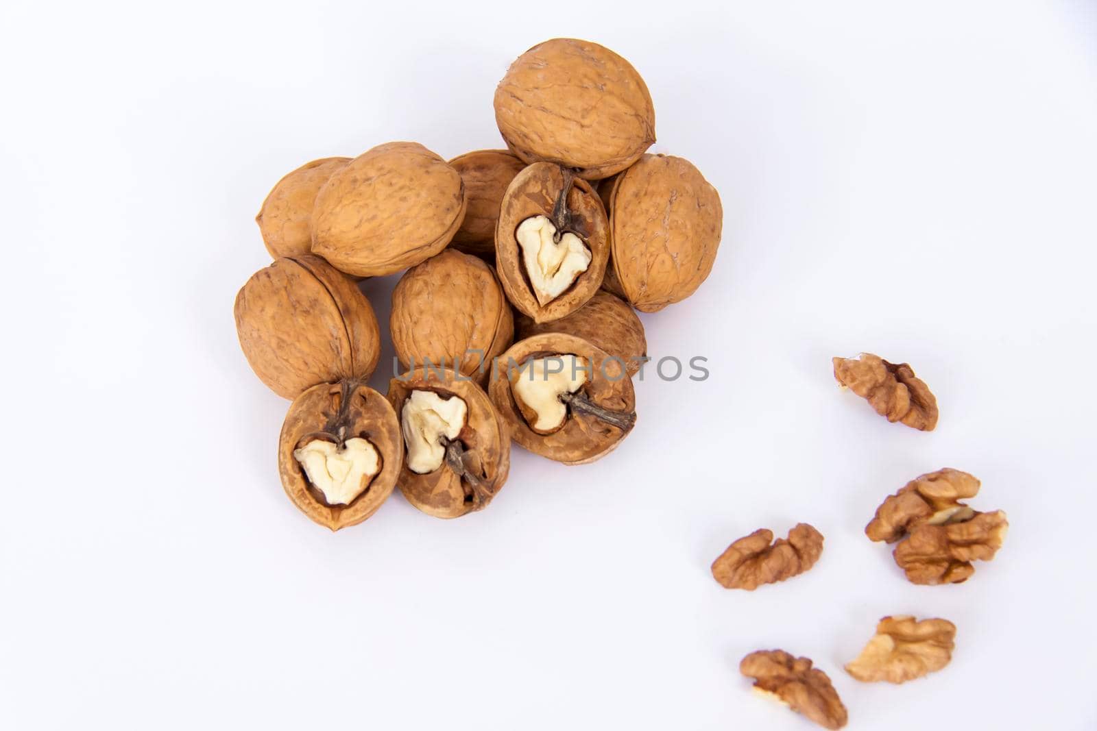 Walnuts in a shell on a white background. Healthy nuts. Walnuts.