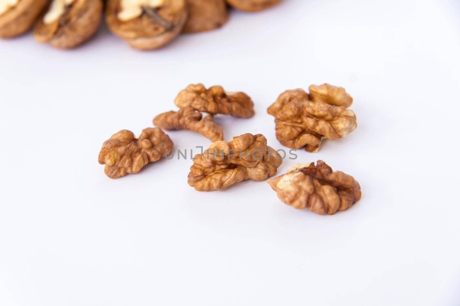 Walnuts in a shell on a white background. Healthy nuts. Walnuts. 