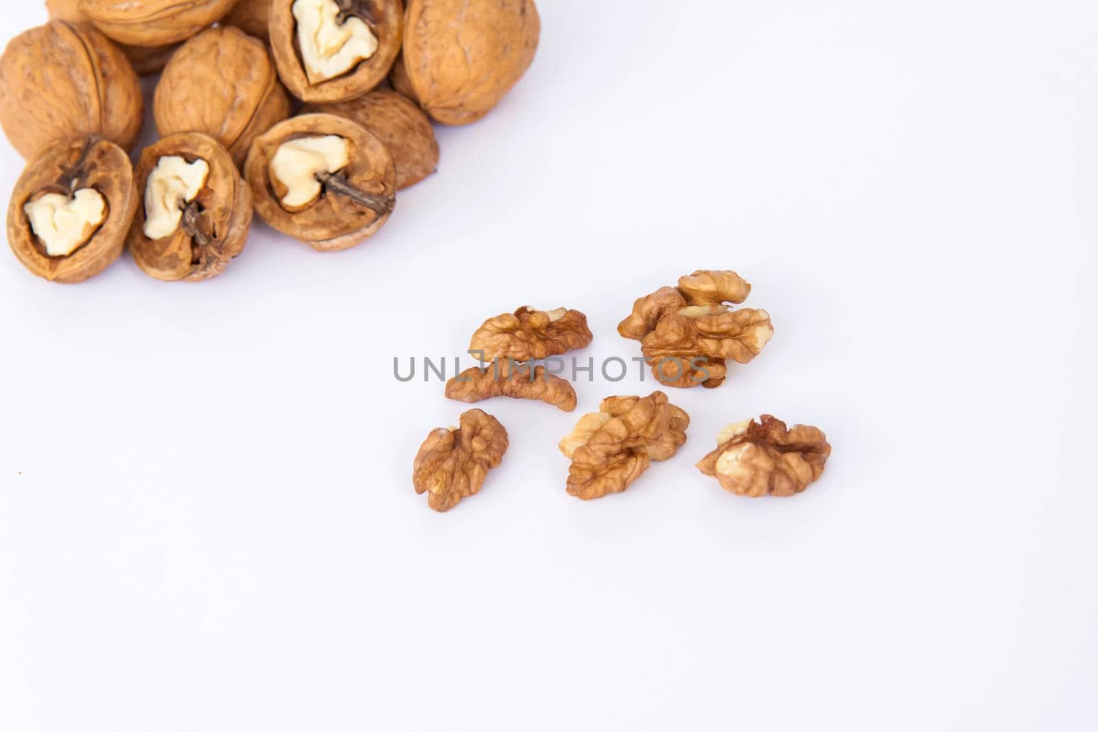 Walnuts in a shell on a white background. Healthy nuts. Walnuts. 