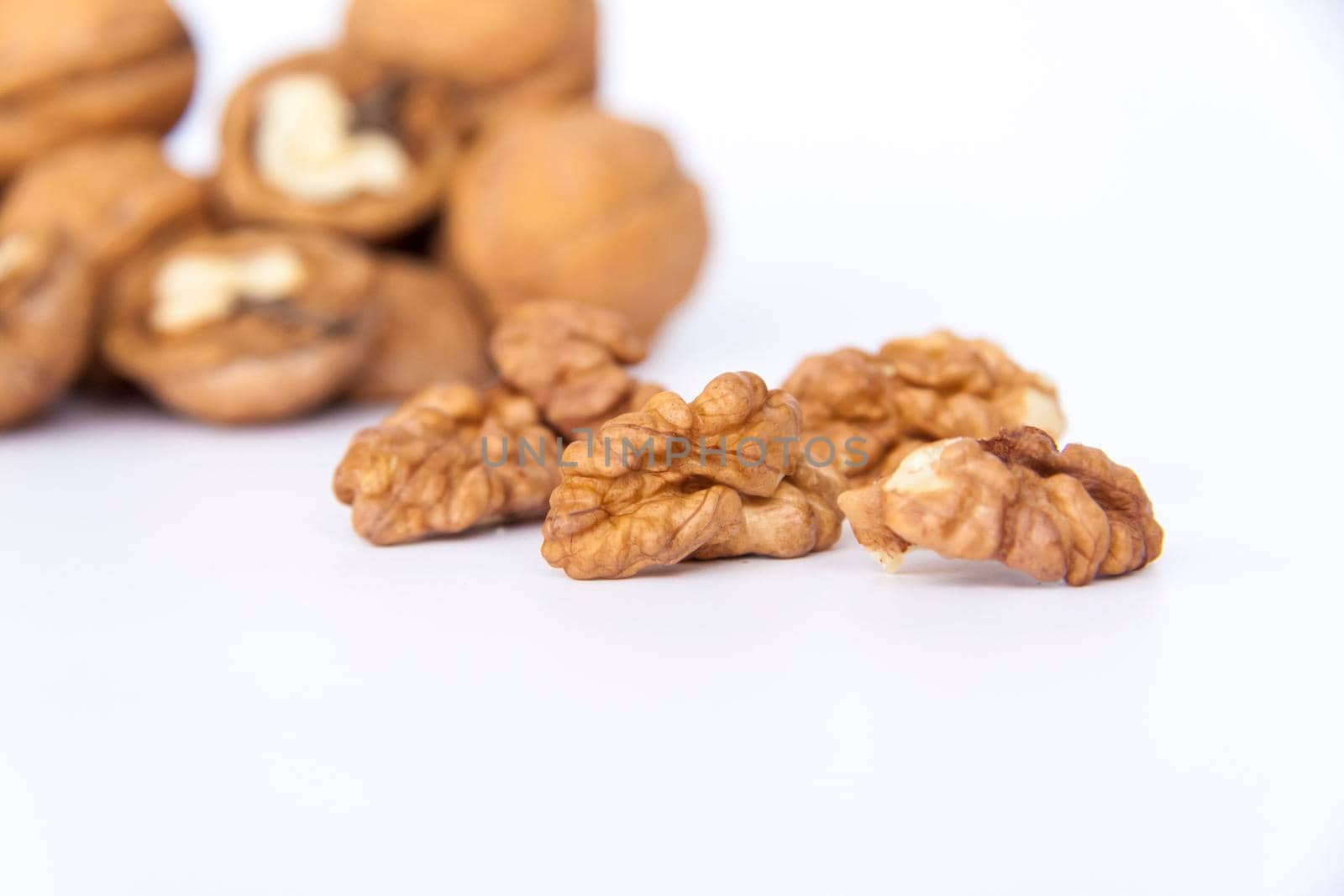 Walnuts in a shell on a white background. Healthy nuts. Walnuts.