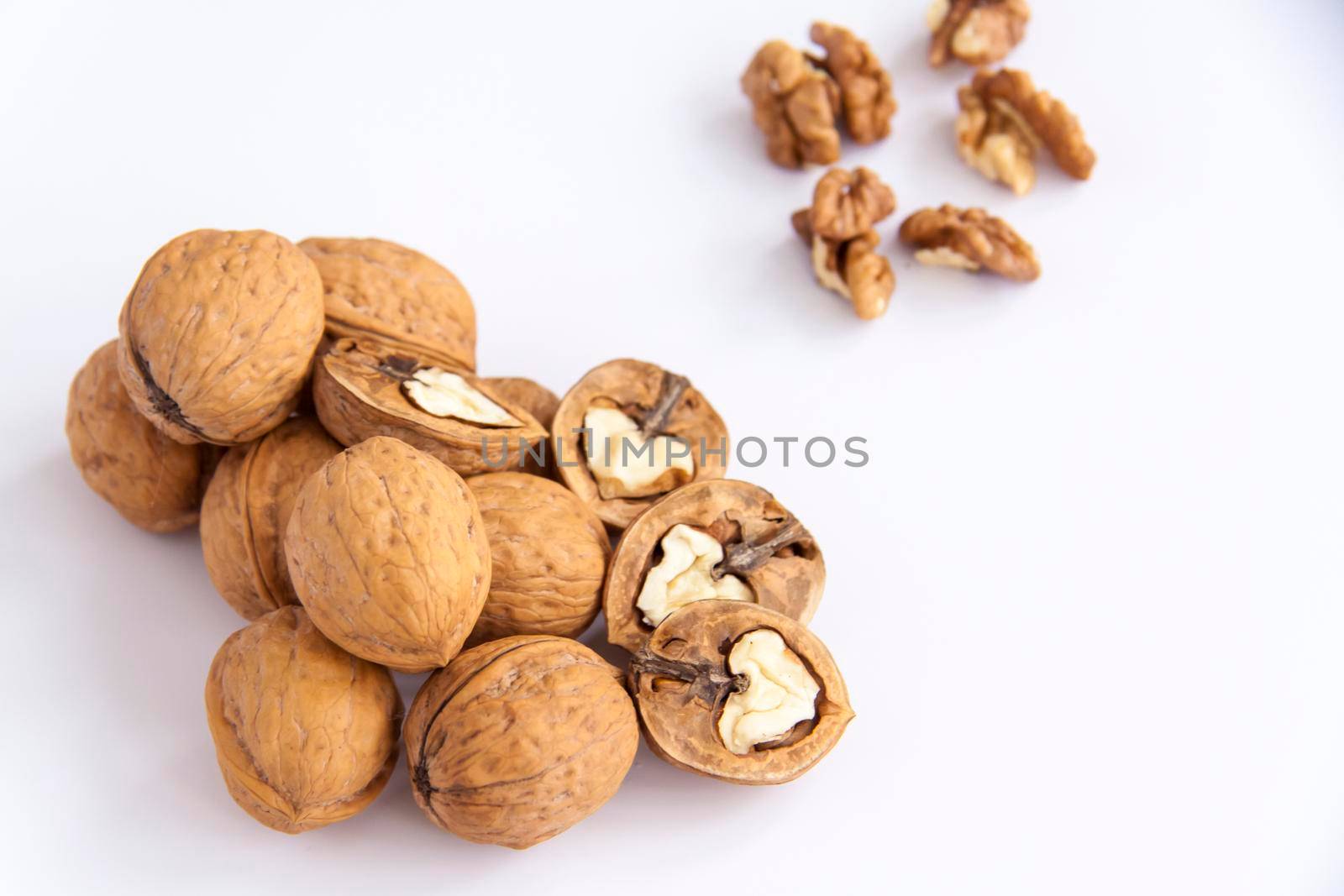 Walnuts in a shell on a white background. Healthy nuts. Walnuts. 