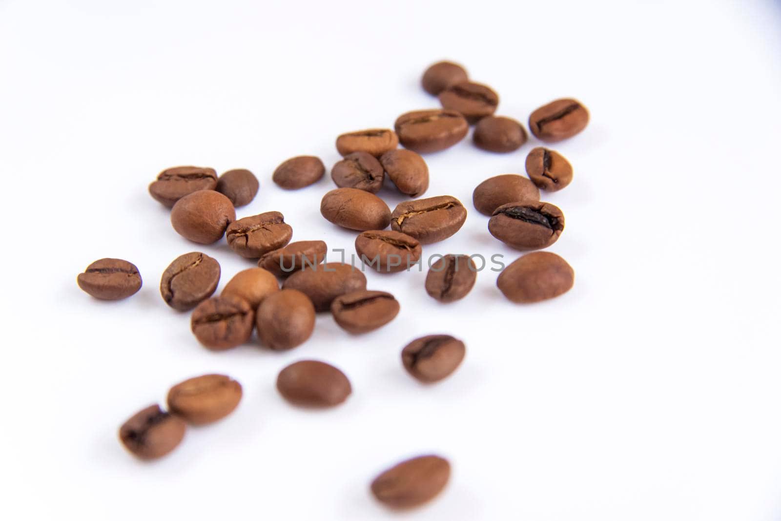 Coffee beans on a white background. Roasted coffee beans. Coffee.