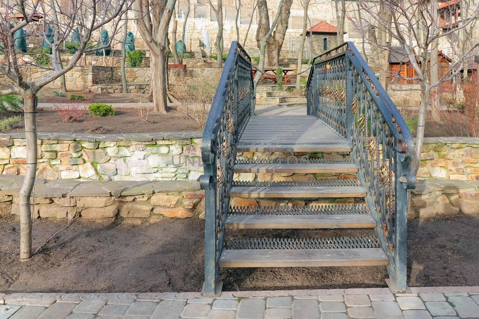 bridge with wrought iron handrails in the Park. High quality photo