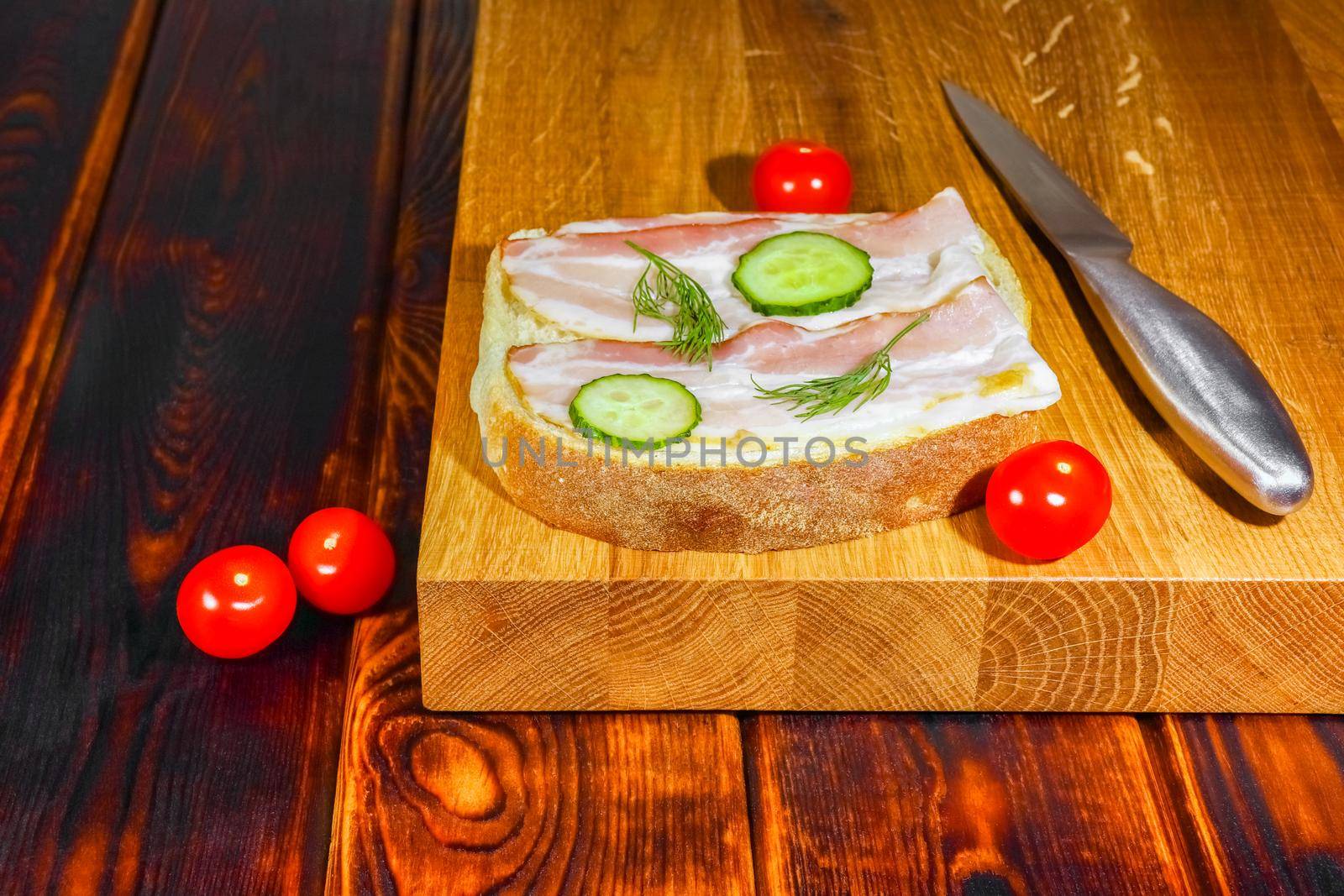 sandwich on the cutting Board as background by roman112007