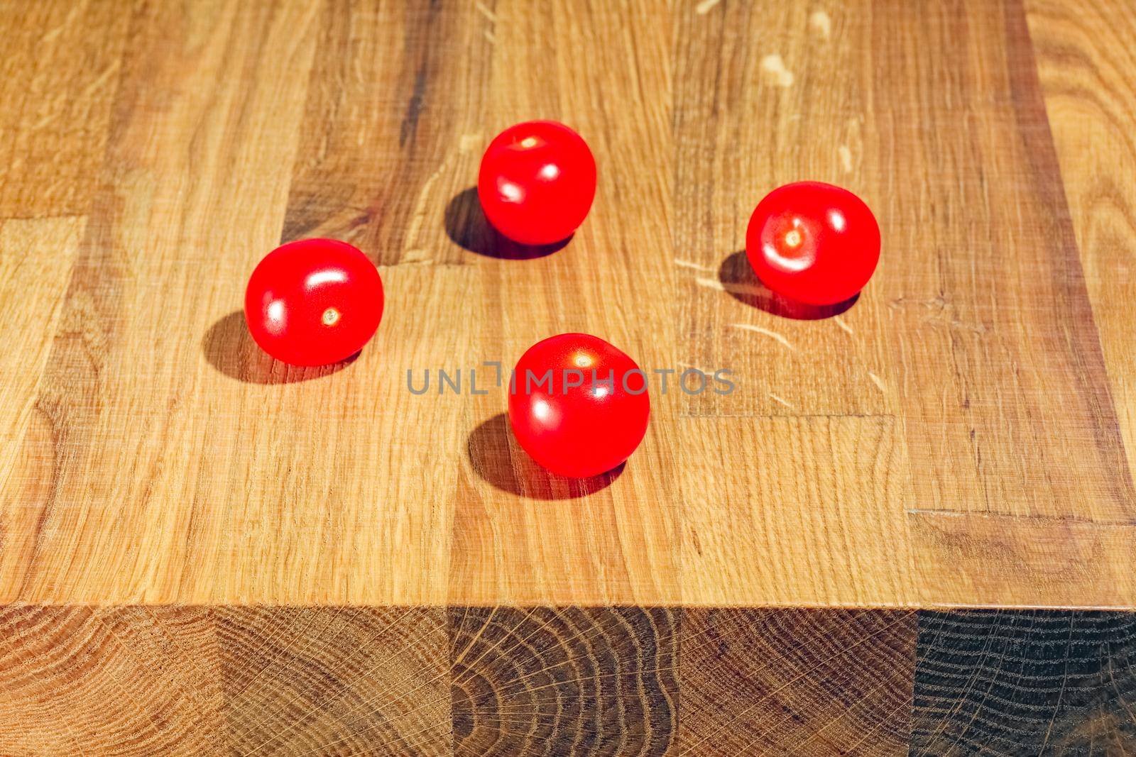 tomato on a chopping Board as background by roman112007