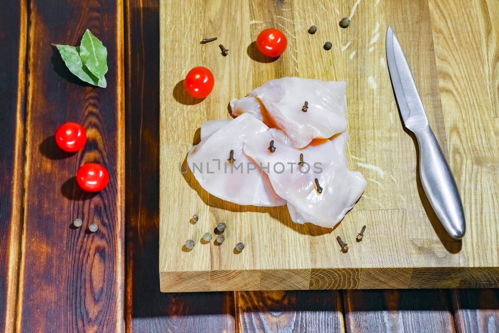 chicken fillet on a cutting Board top view by roman112007