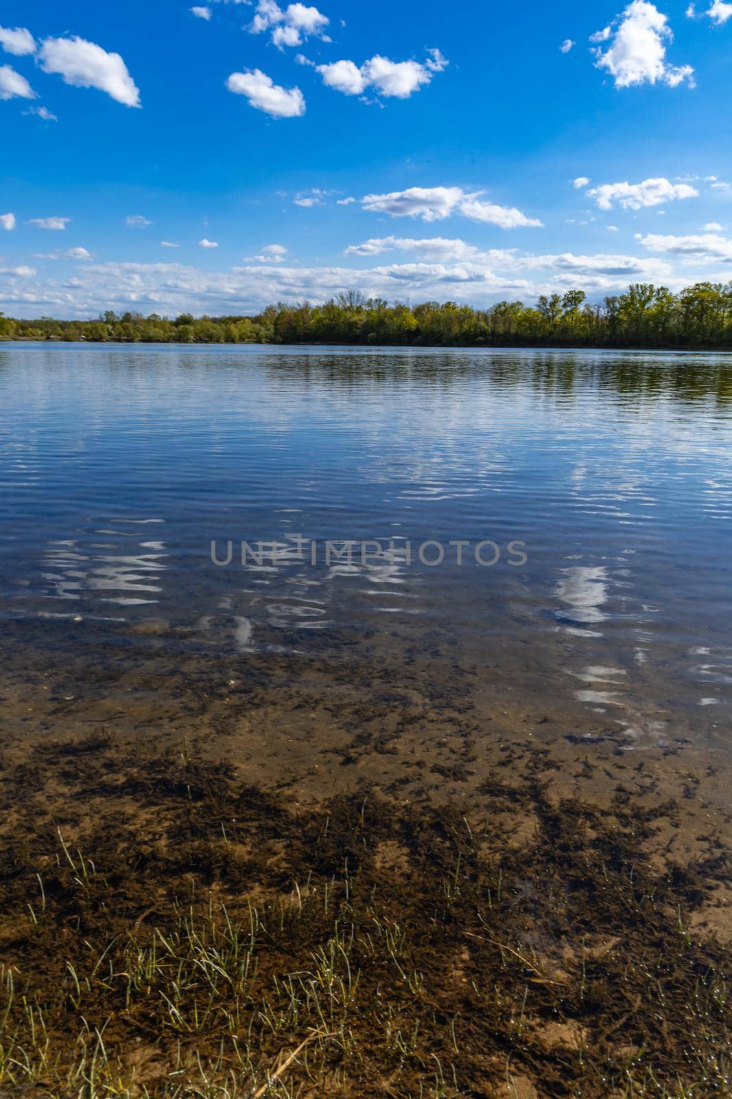 Vertical landscape of big Bajkal lake at sunny cloudy day at coast of peninsula