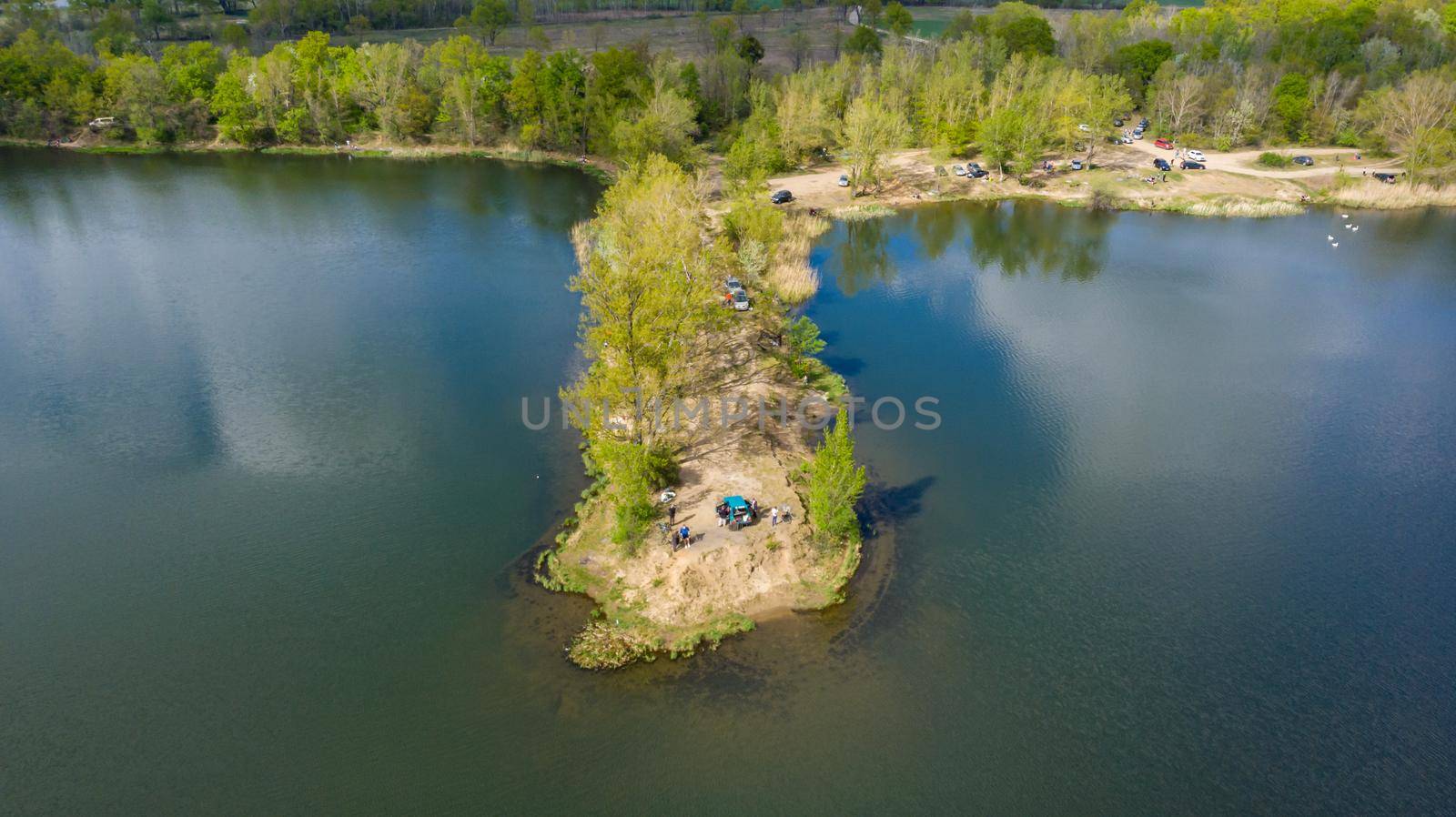Aerial drone view to Small peninsula with trees and bushes on big Bajkal lake 