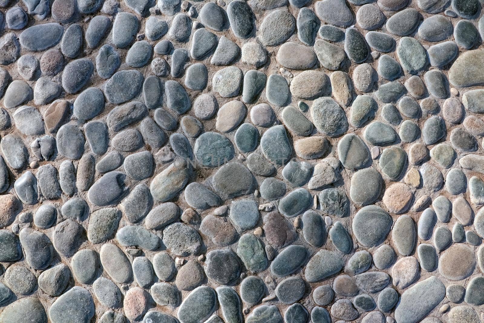 masonry wall paving stones as a background close up by roman112007