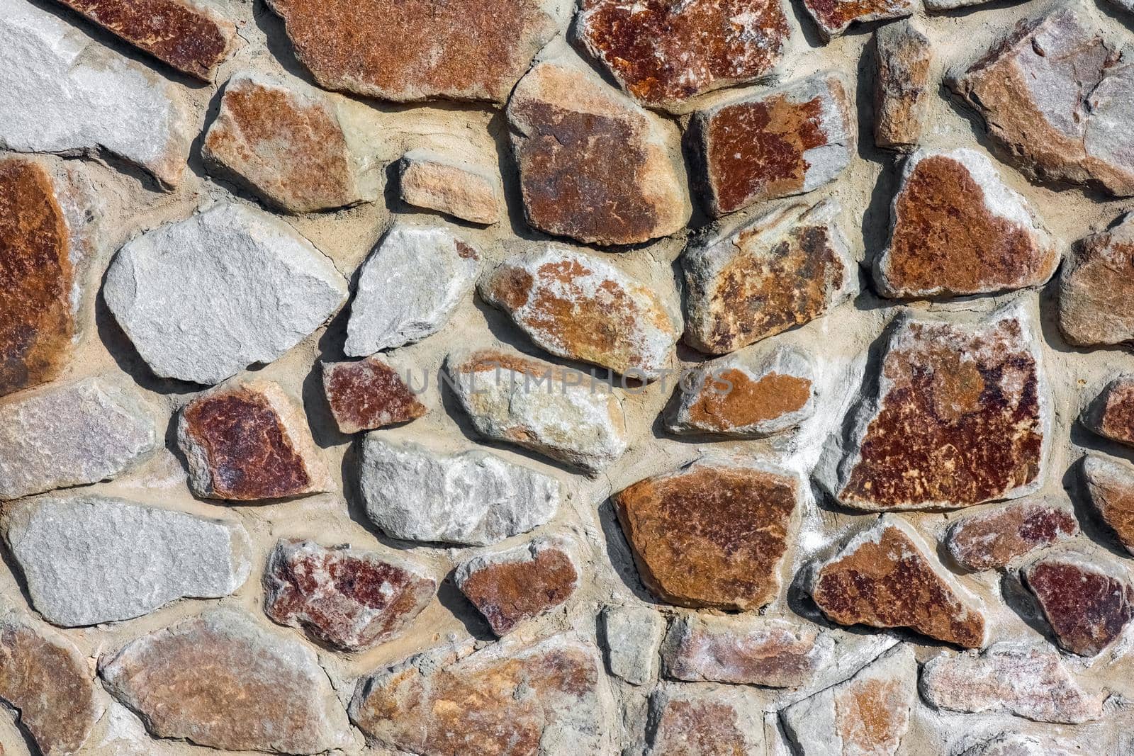 masonry wall paving stones as a background close up by roman112007