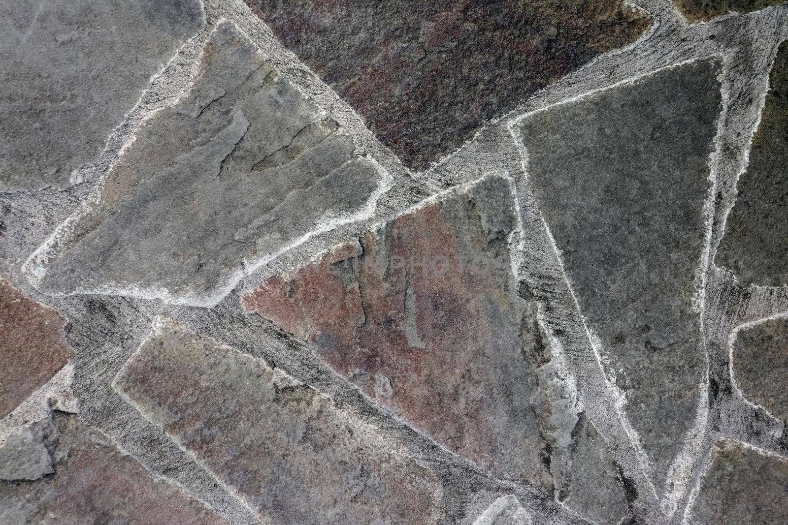 masonry wall paving stones as a background close up. High quality photo