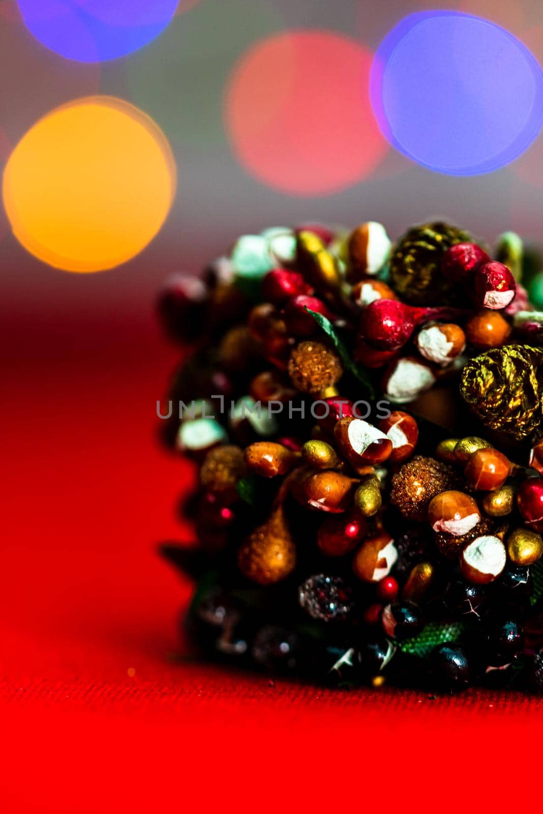 Colorful decorated Christmas wreaths isolated on background of blurred lights. by vladispas