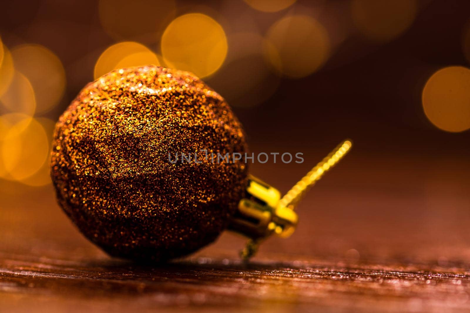 Colorful Christmas ball isolated on blurred and shiny background of lights. Christmas baubles isolated. by vladispas