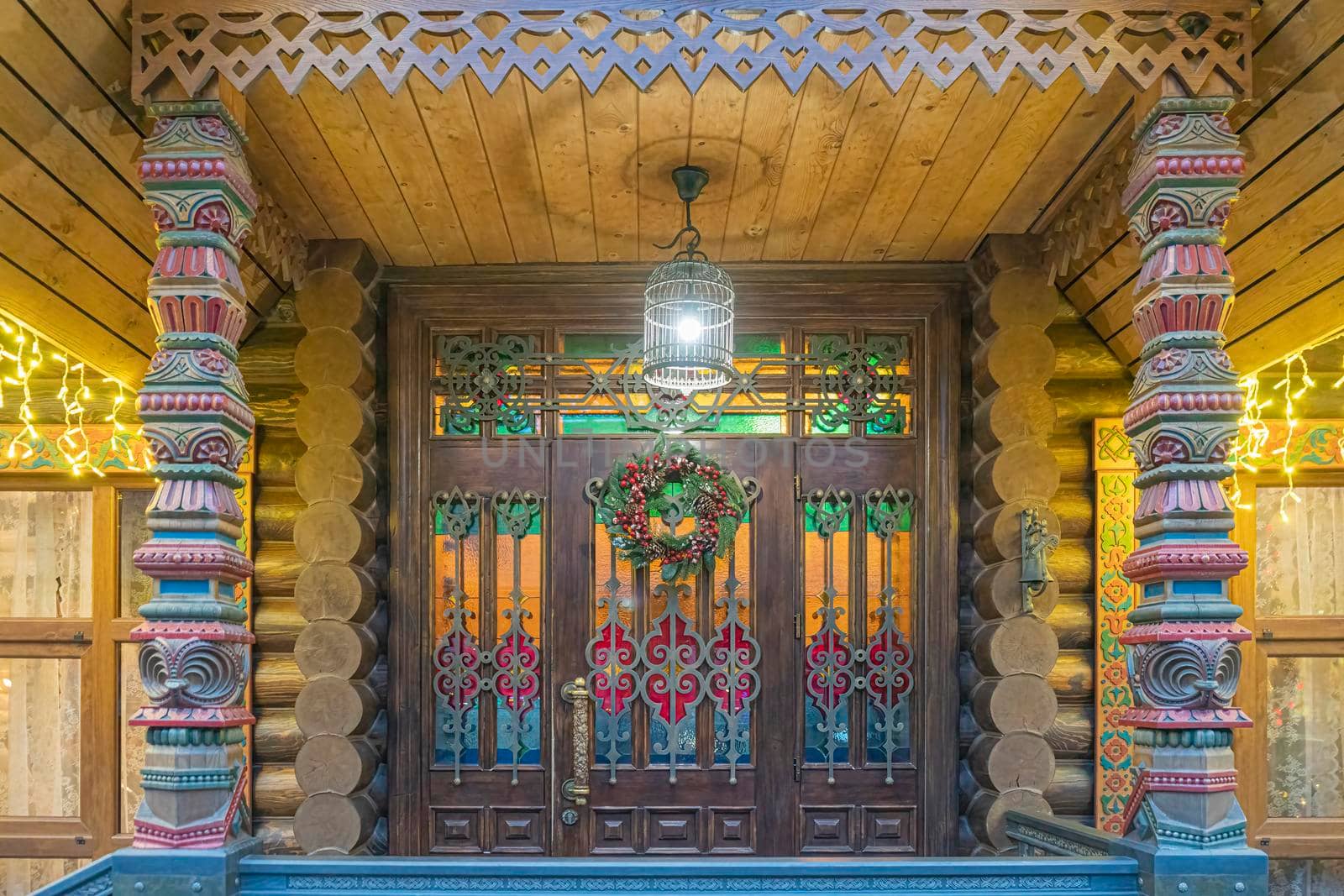 colorful carved entrance to a log house close-up. High quality photo