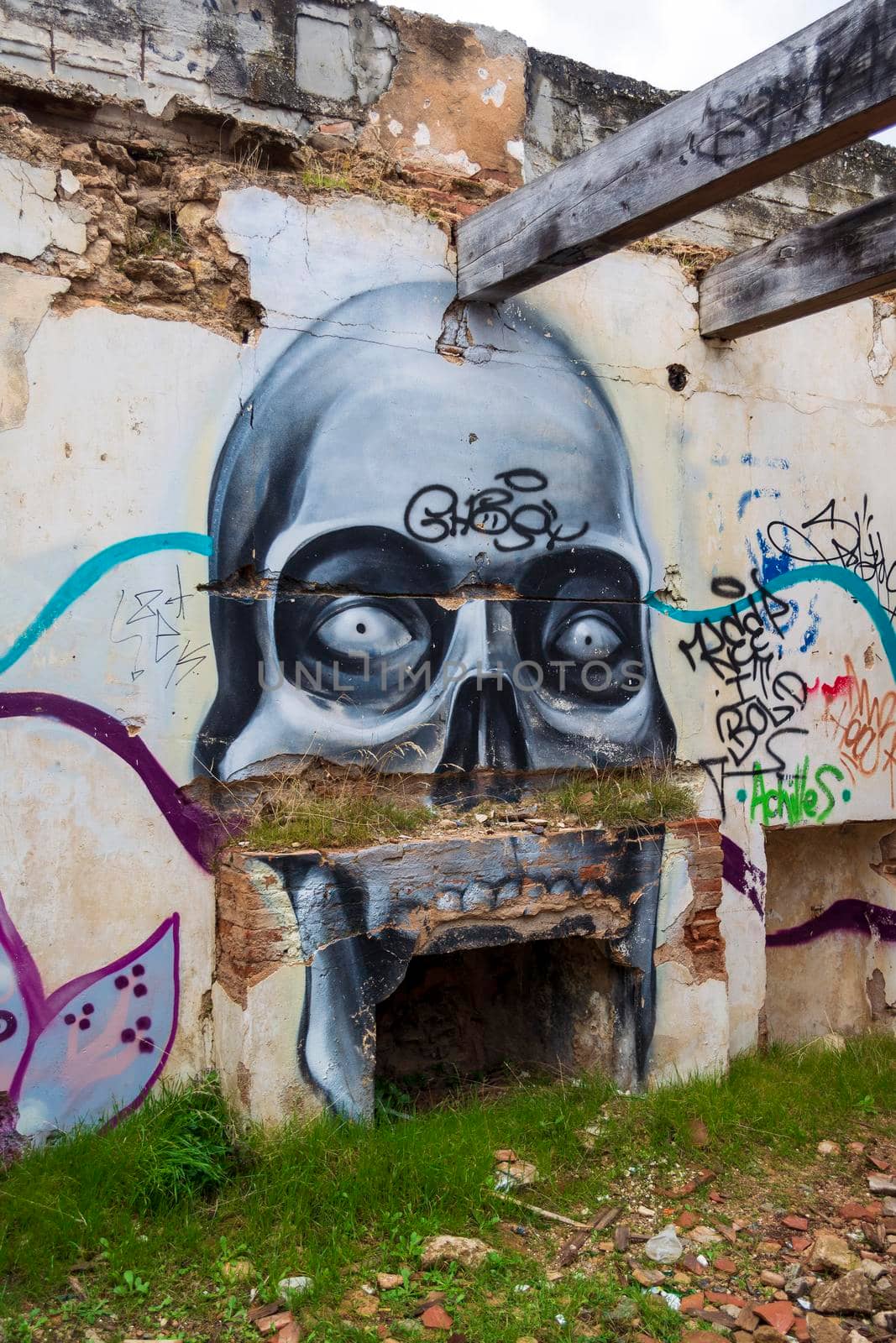 Villa Levidi, Pallini, Greece - February 14, 2021: Skull wall painting at an abandoned old villa at Pallini, Greece
