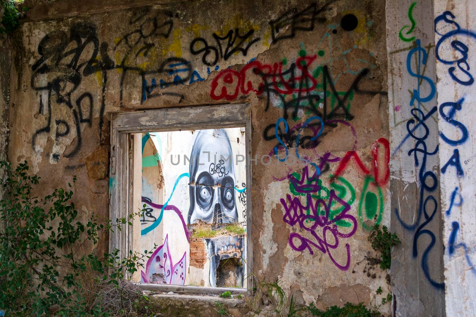 Villa Levidi, Pallini, Greece - February 14, 2021: Skull wall painting at an abandoned old villa at Pallini, Greece