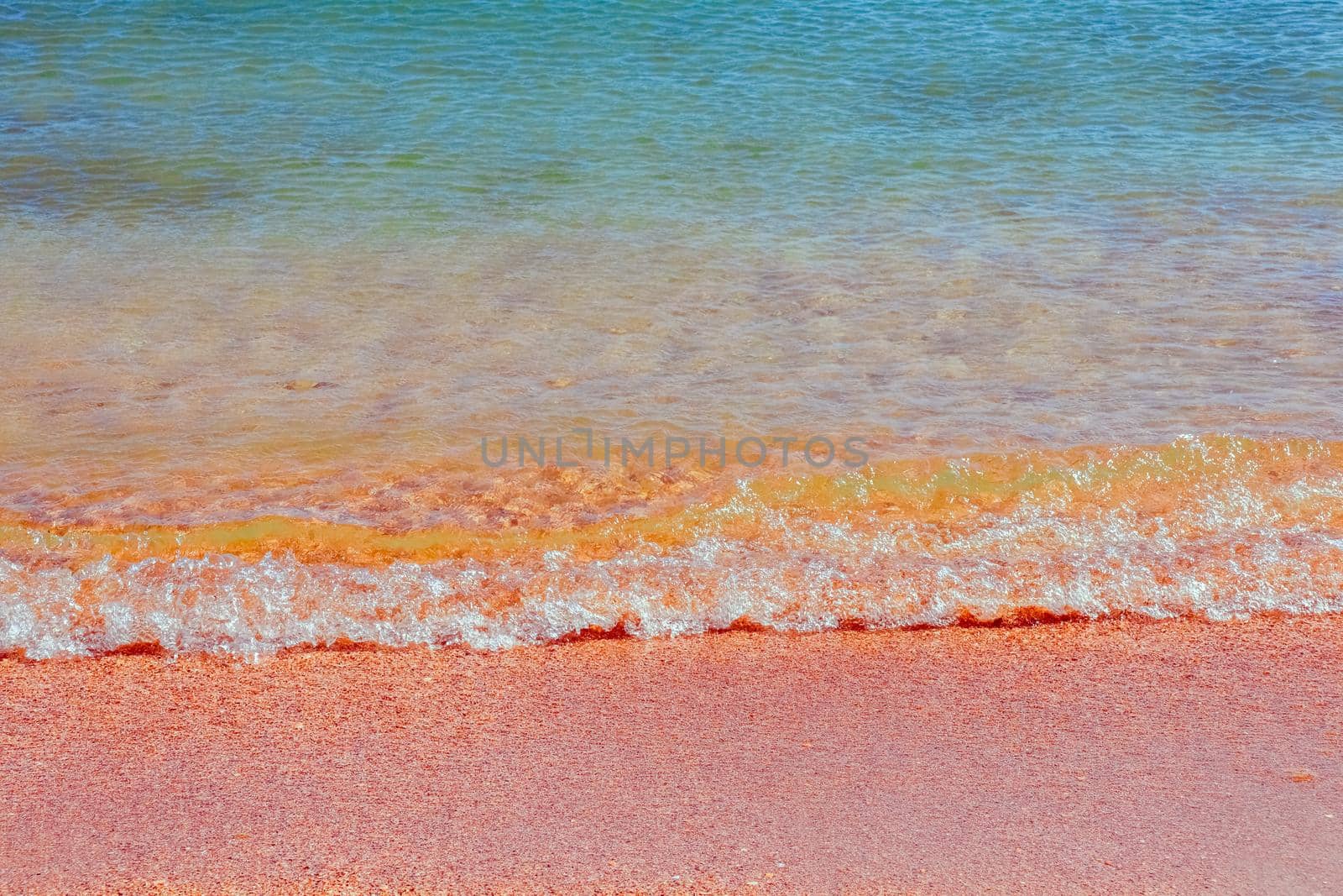 Soft Wave Of Blue Ocean On Sandy Beach. Background. Selective focus by roman112007