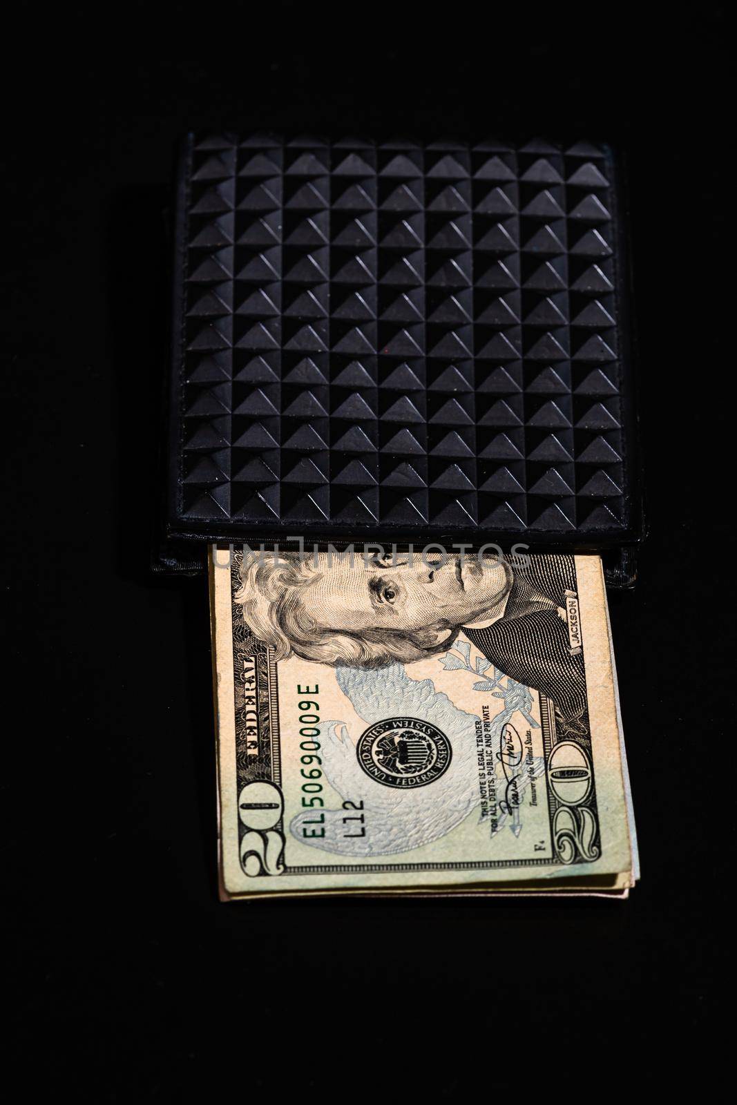 50 Dollars banknotes in a black wallet isolated. by vladispas