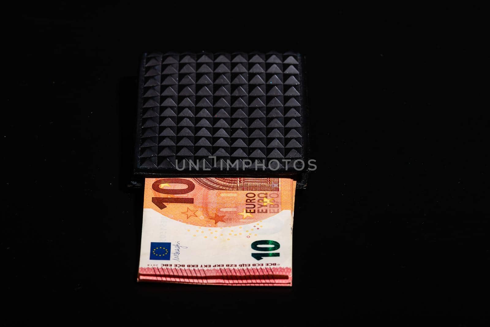10 Euro money banknotes in blak wallet isolated