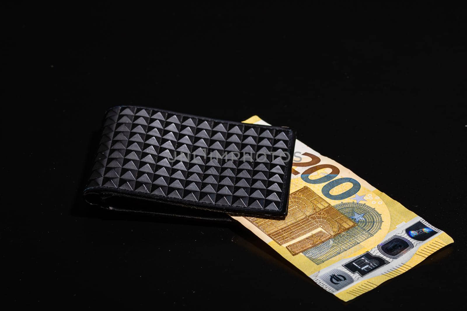 200 Euro banknotes in a black wallet isolated. by vladispas