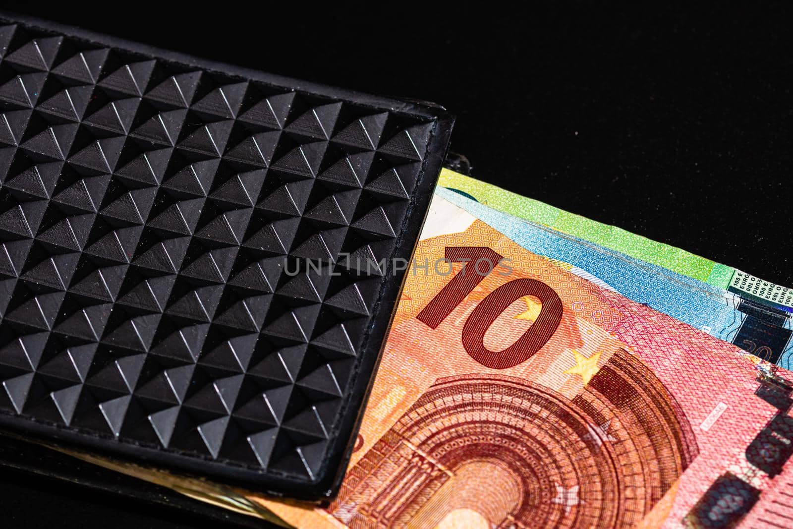 Euro banknotes in black wallet isolated. by vladispas