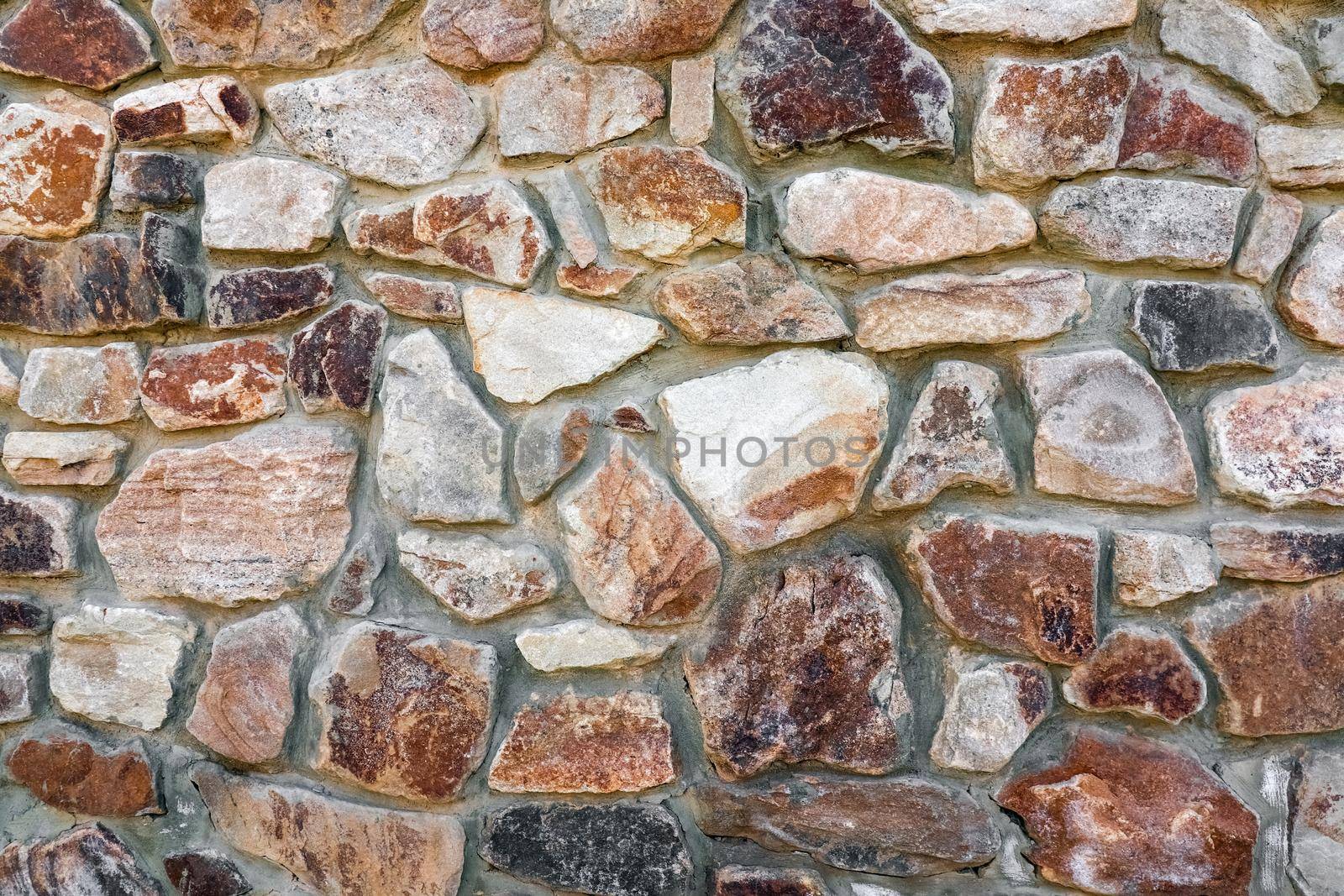 masonry wall paving stones as a background close up by roman112007