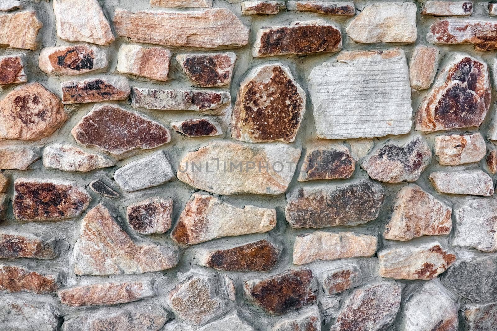 masonry wall paving stones as a background close up by roman112007