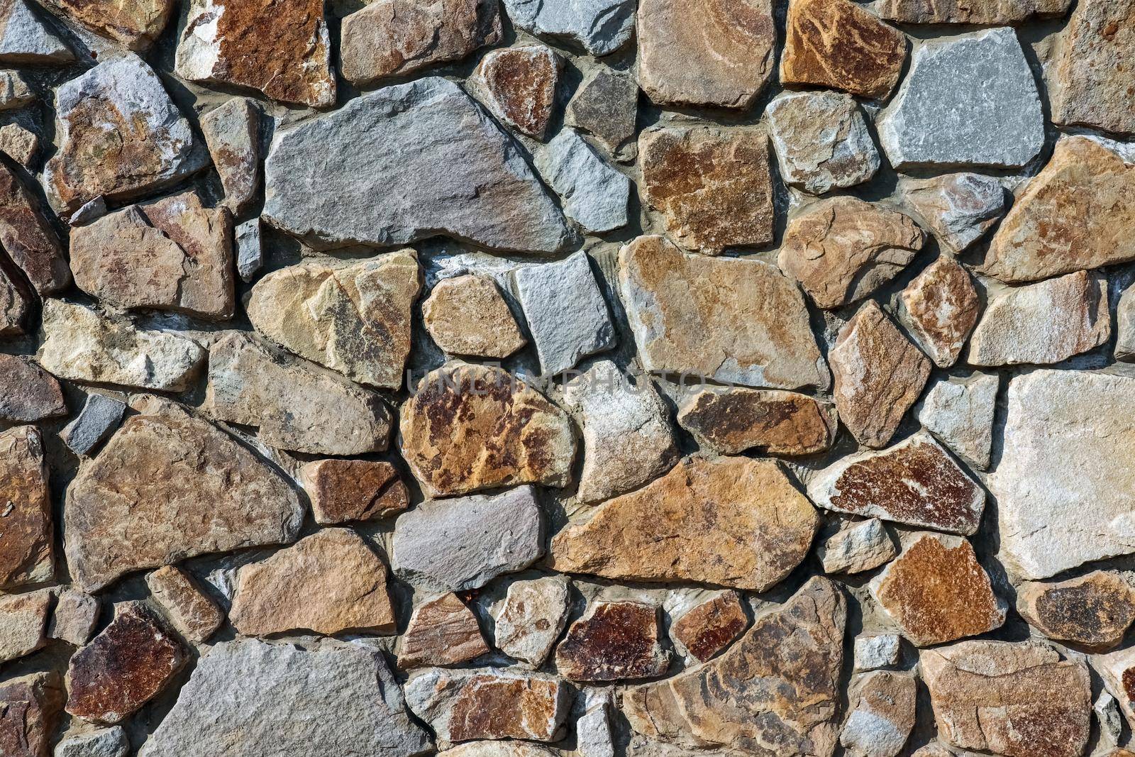 masonry wall paving stones as a background close up