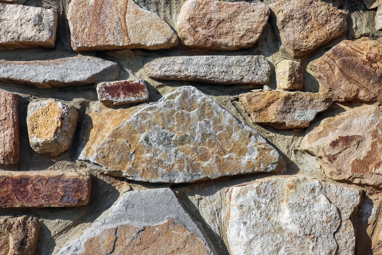 masonry wall paving stones as a background close up. High quality photo
