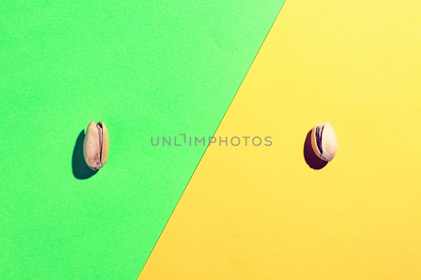 pistachios on a multicolored background top view. High quality photo