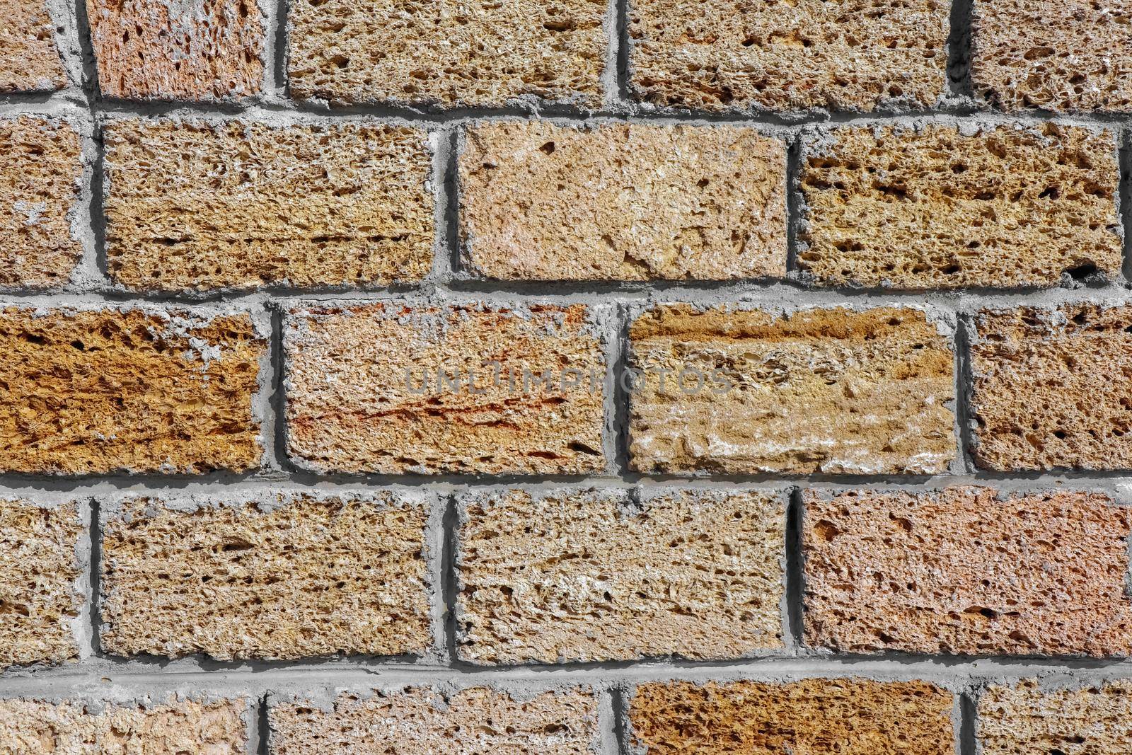 masonry wall paving stones as a background close up