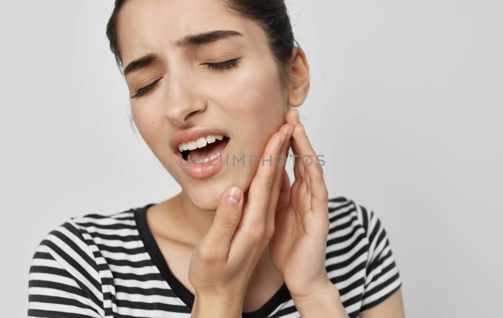 woman holding face health problems teeth pain medicine. High quality photo