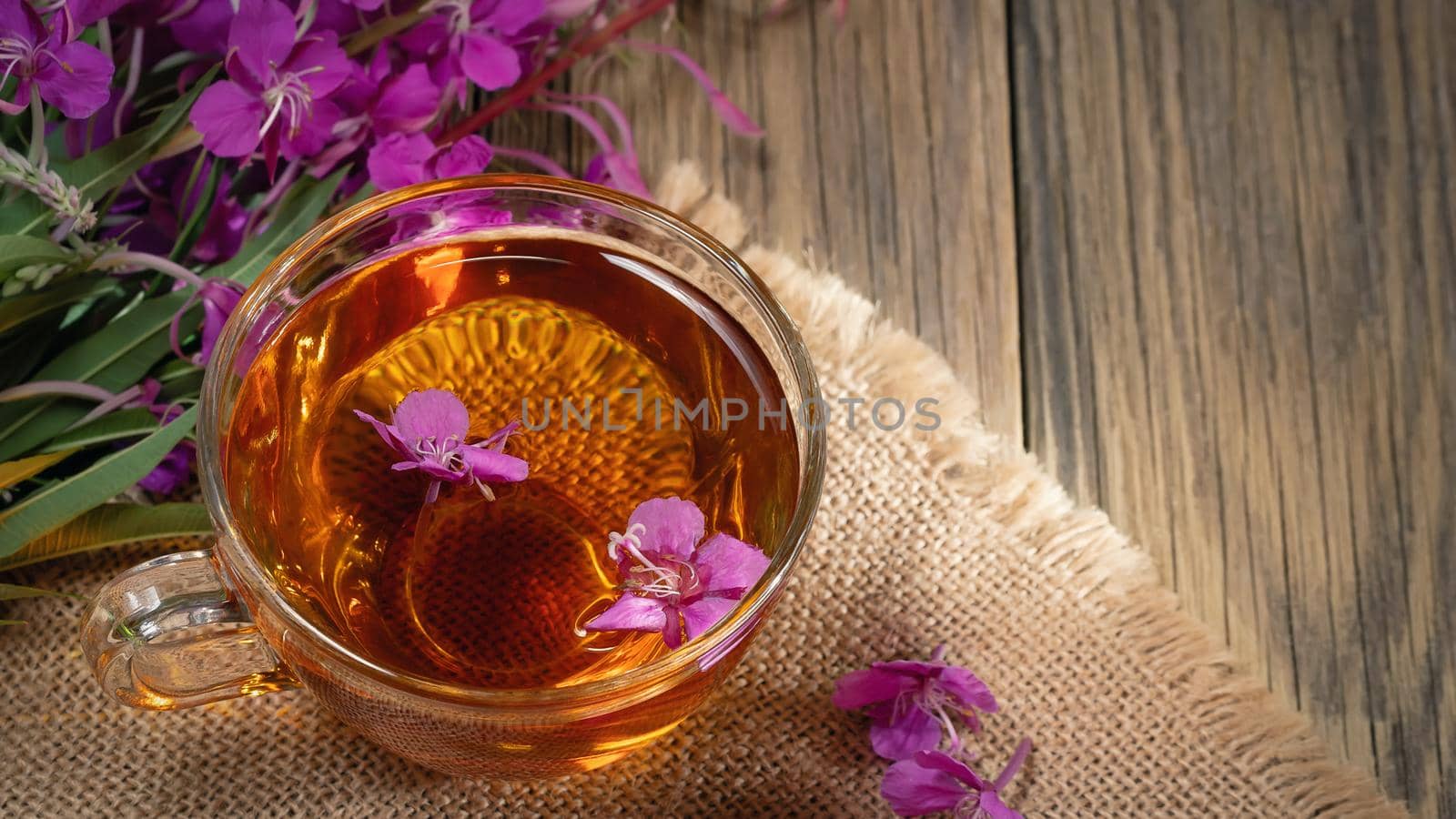 Herbal tea made from fireweed known as blooming sally in cup, copy space by galsand