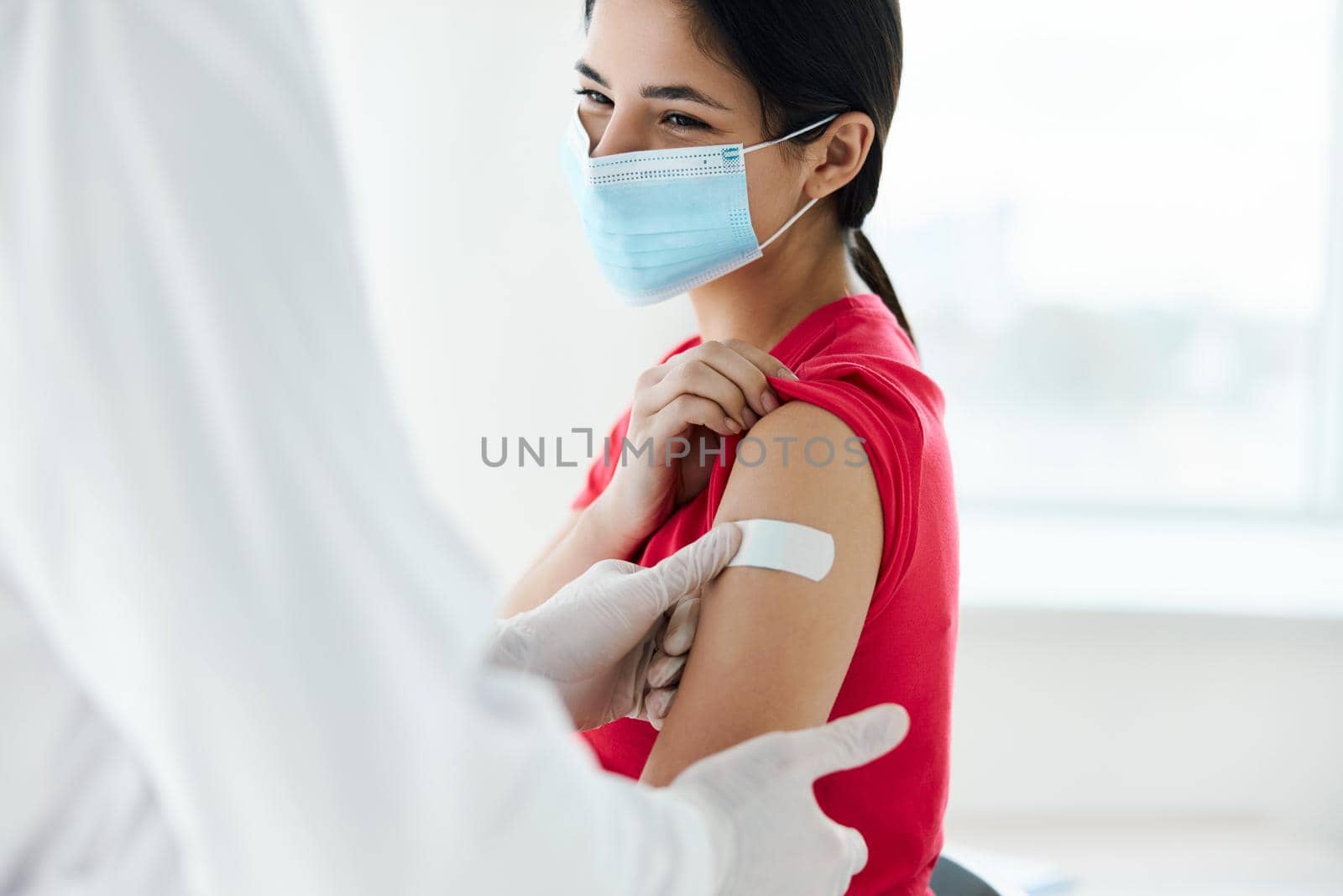 woman wearing medical mask patient injection coronavirus. High quality photo