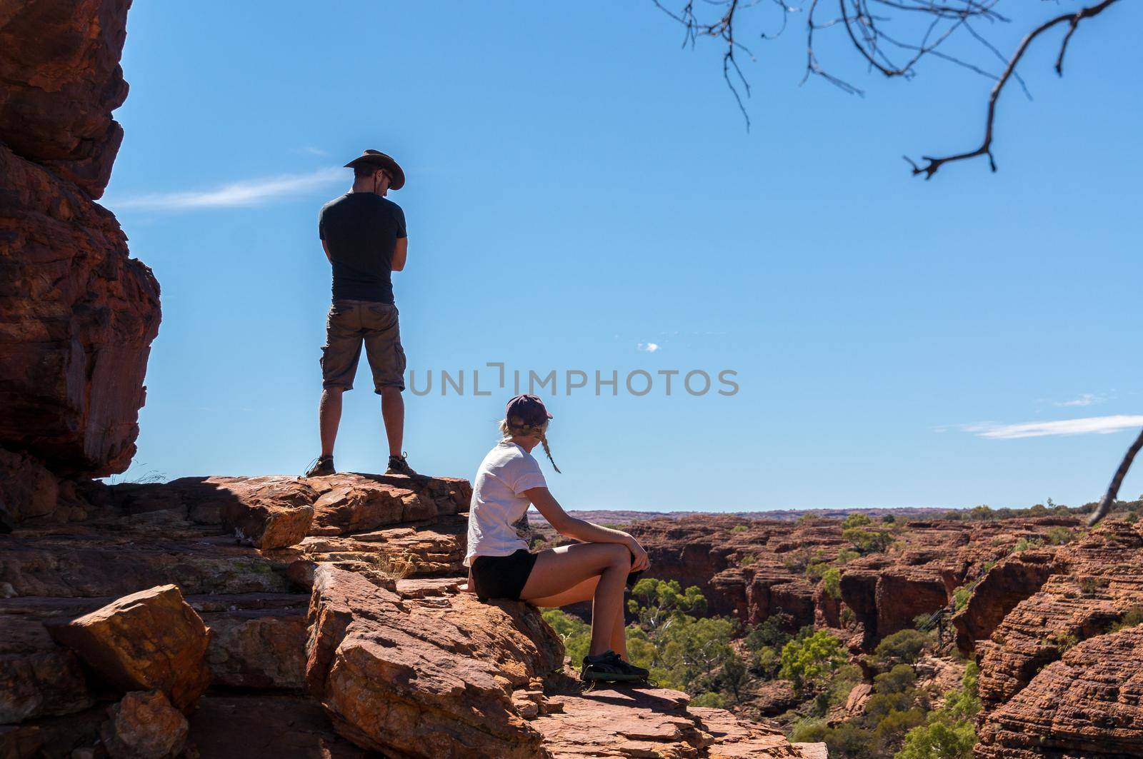 KINGS CANYON, AUSTRALIA May 5, 2015: young women and man enyoing view of the Kings Canyon