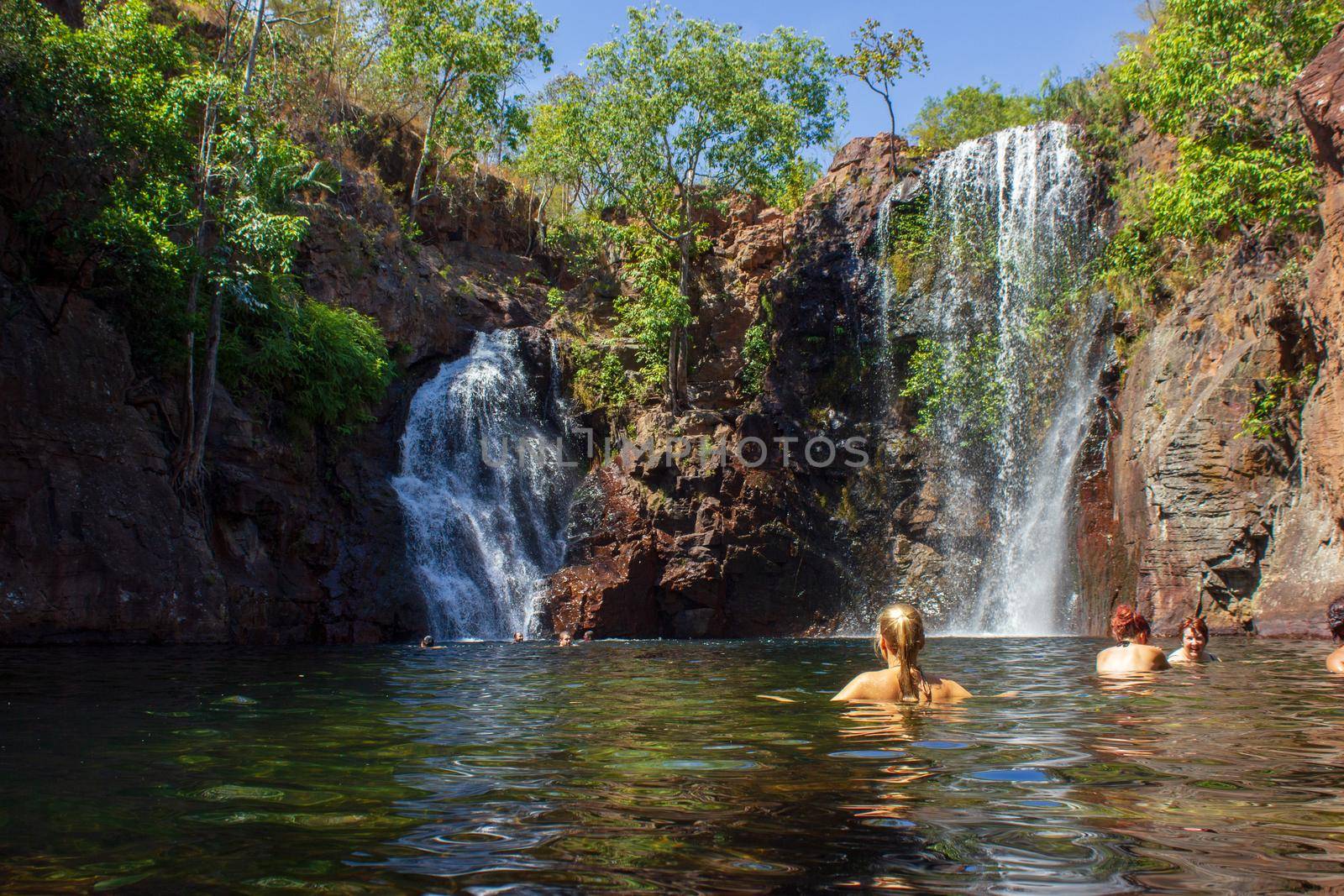 Tourists and residents enjoy refreshing swim at Florence Falls, very popular desitination for tourists and locals alike, Litchfield National Park, Northern Territory, Australia by bettercallcurry