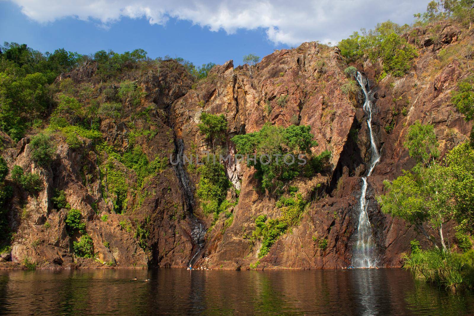 beautiful wangi waterfalls at sunset in litchfield national park, northern territory by bettercallcurry