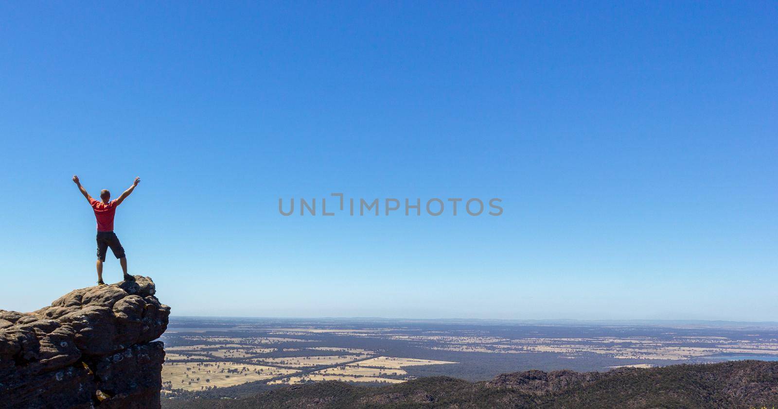 man standing on the edge of a rock at the Boroka Lookout, Grampians National Park, Australia