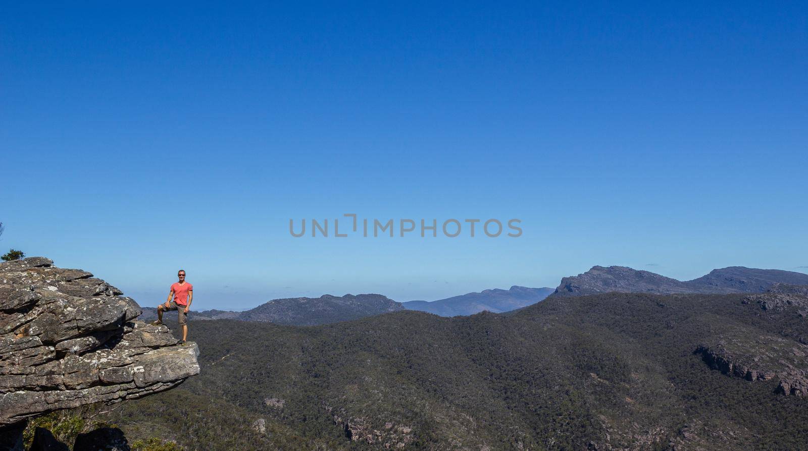 man standing at the Reeds Lookout at the Balconies, Victoria, Australia by bettercallcurry