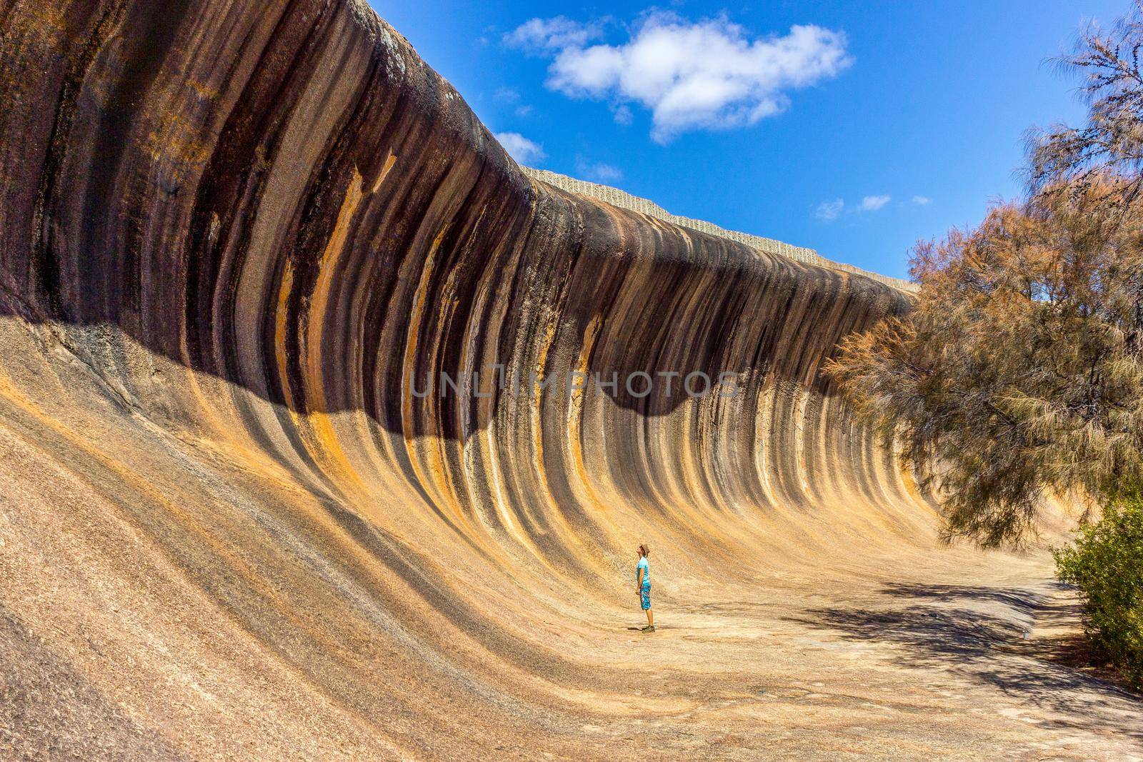 young caucasian man standing at Wave Rock. Wave Rock, Hyden, Western Australia by bettercallcurry