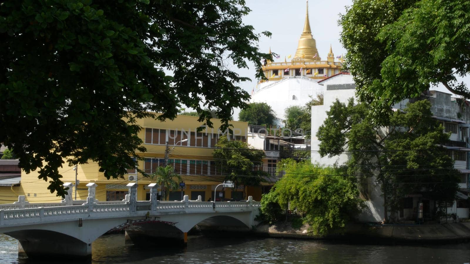 BANGKOK, THAILAND, 11 JULY 2019: Canal as classic typical water way for public passengers transportation. Street city life on khlong. Local people use boat as traditional transport during traffic jam.