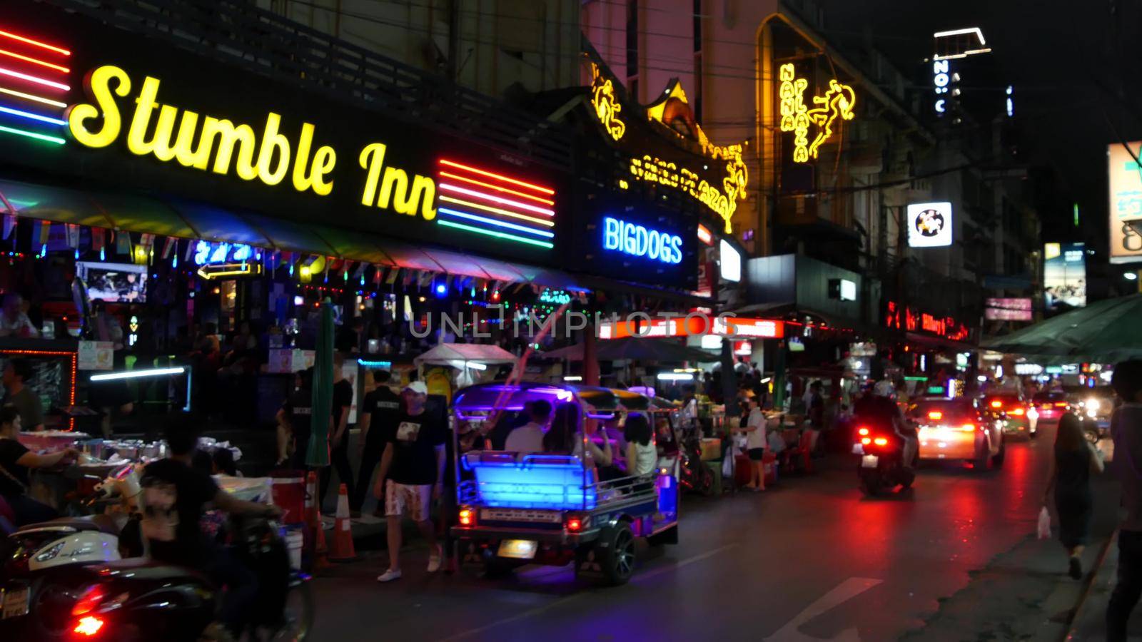 BANGKOK, THAILAND,13 JULY 2019 Vivid neon signs glowing, Nana Plaza street. Nightlife in erotic Red light district soi. Illuminated bar and adult go-go show club. Night life tourist entertainment