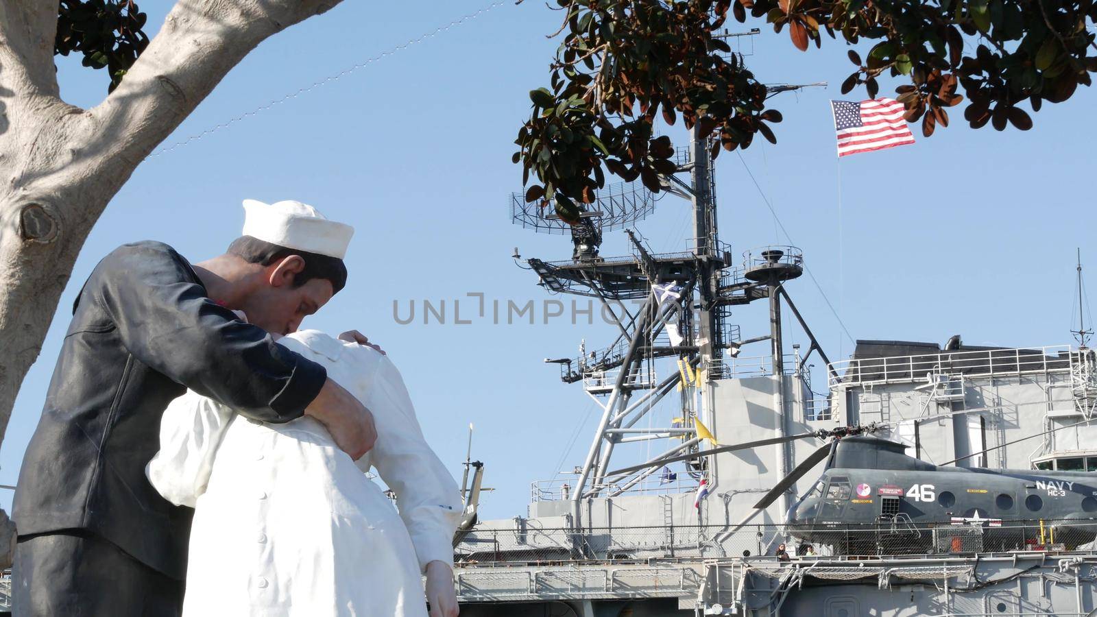 SAN DIEGO, CALIFORNIA USA - 23 FEB 2020: Unconditional Surrender Statue, USS Midway Museum. Symbol of navy fleet and Victory over Japan Day. Sailor kissing a woman, World War II memorial sculpture by DogoraSun