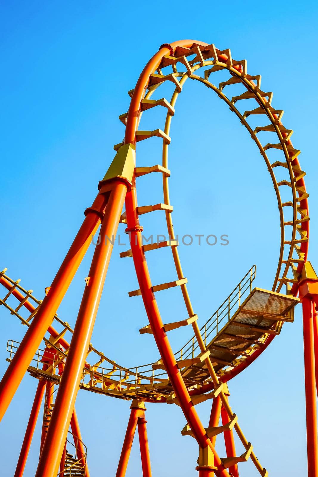 rollercoaster track and the blue sky by ponsulak