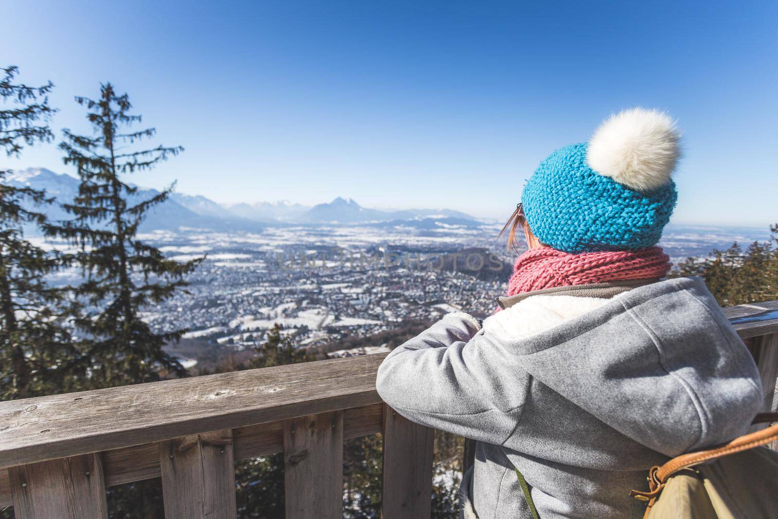 Back of young woman enjoying the view over the mountains, outlook. Gaisberg, Austria